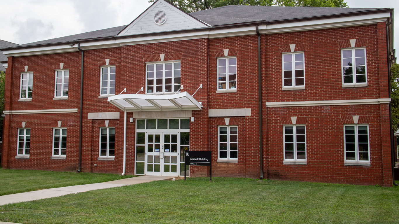 The main entrance and front face of the Schmidt Vocal Arts Building facing Rose Street; a red brick building with many windows and a gray roof.