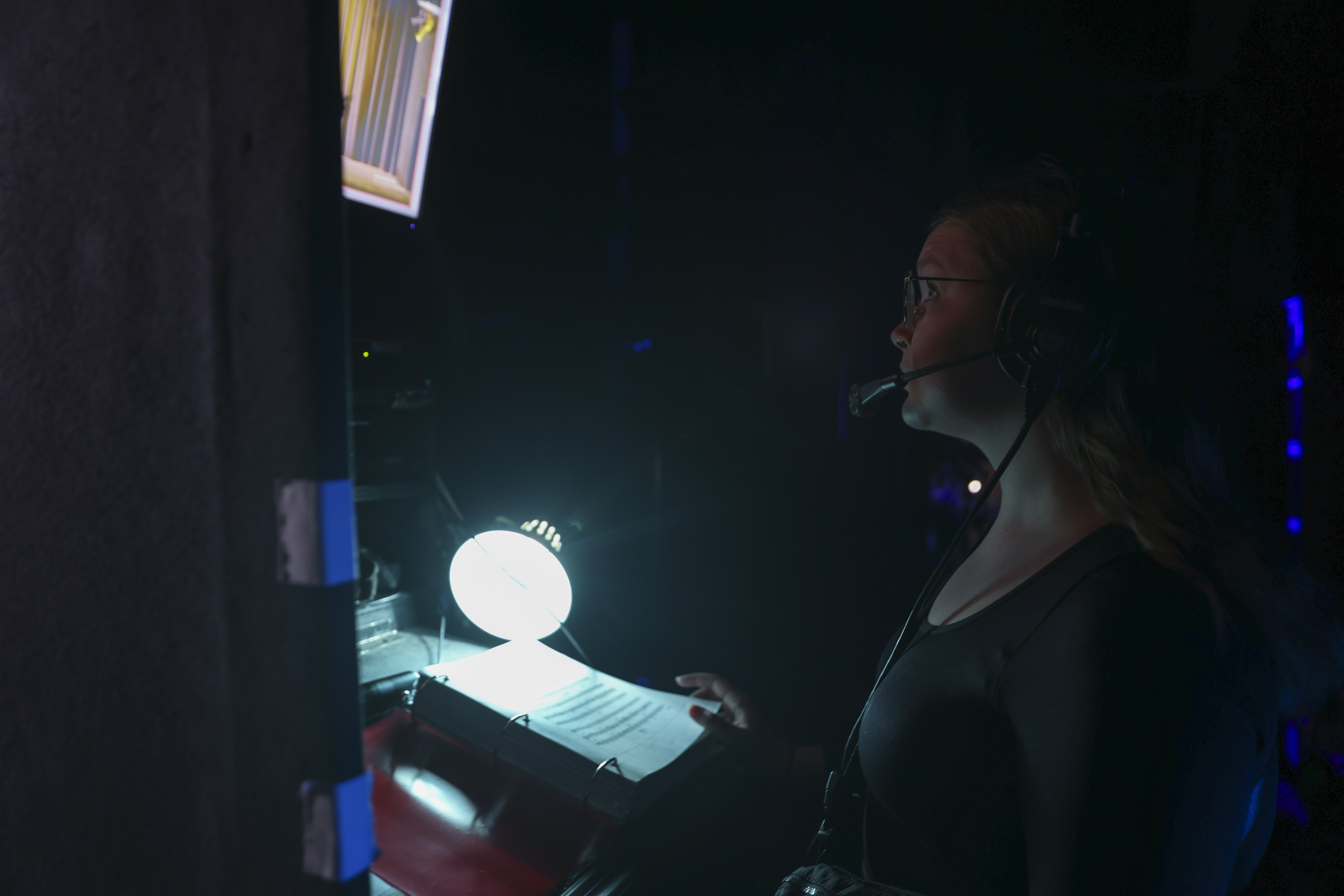 Student backstage at production of Urinetown