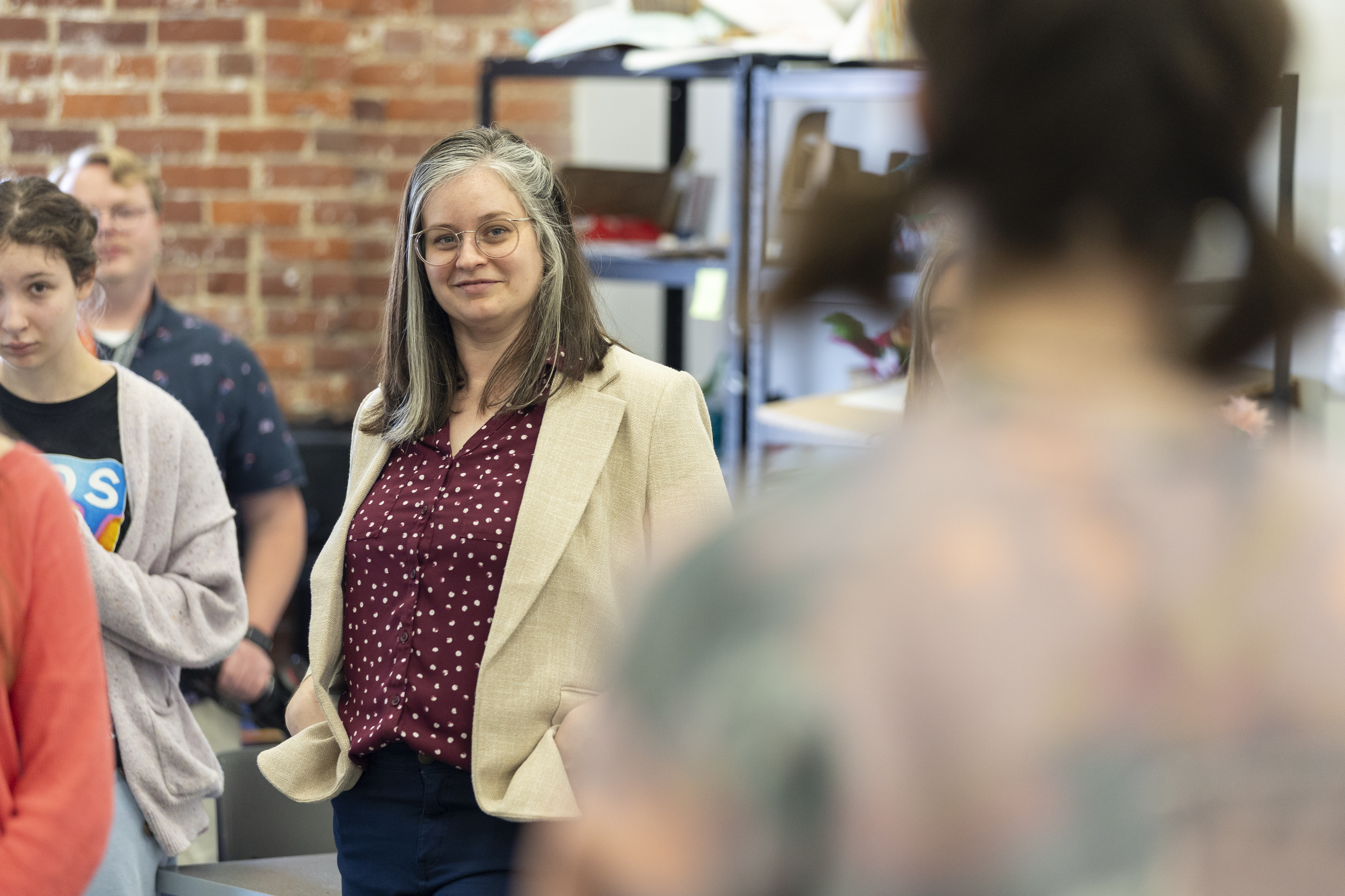 Art education students and professor in classroom