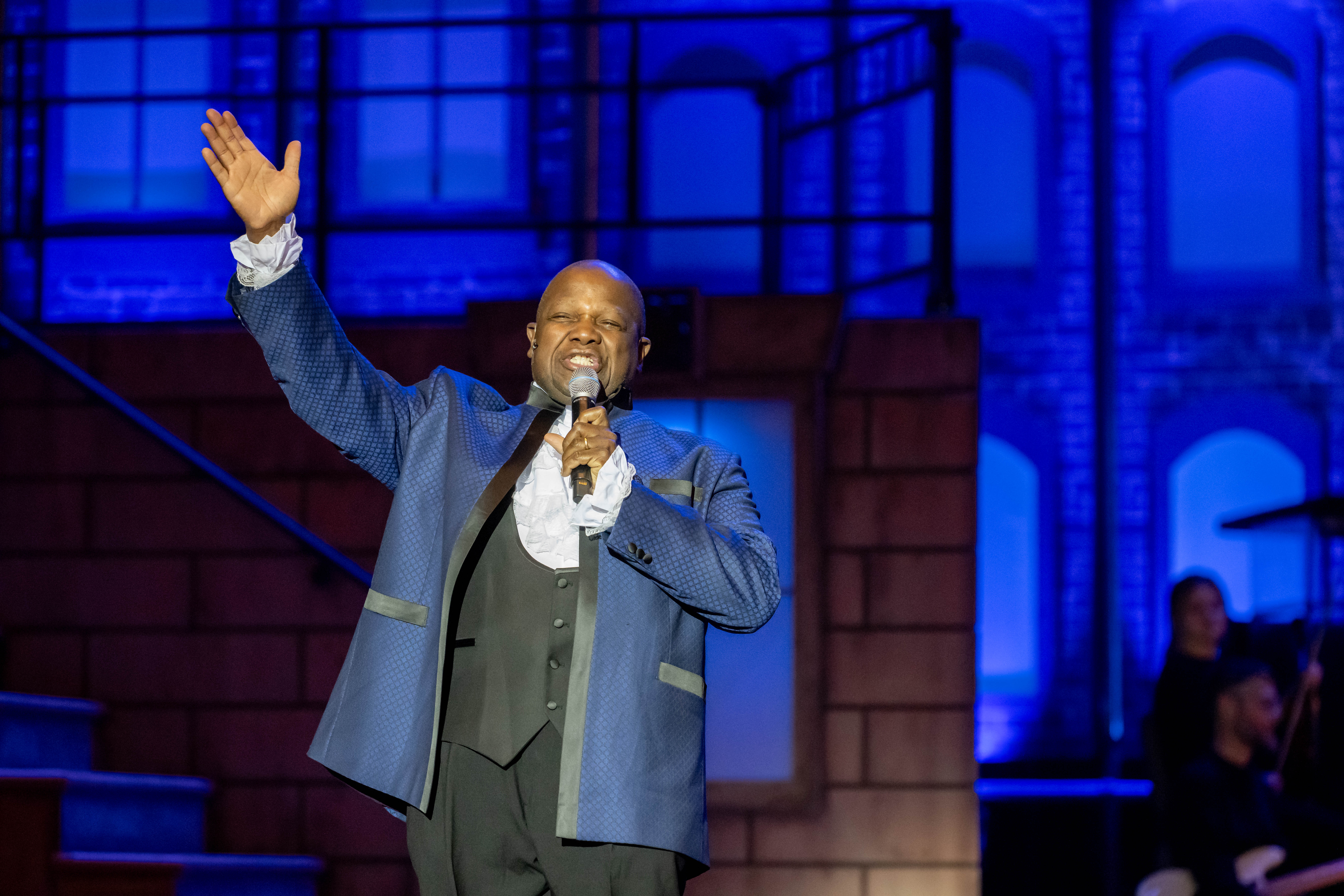 Everett McCorvey with arm in air