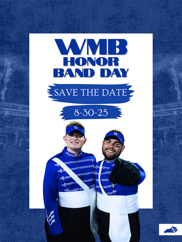 two band members in blue looking at camera