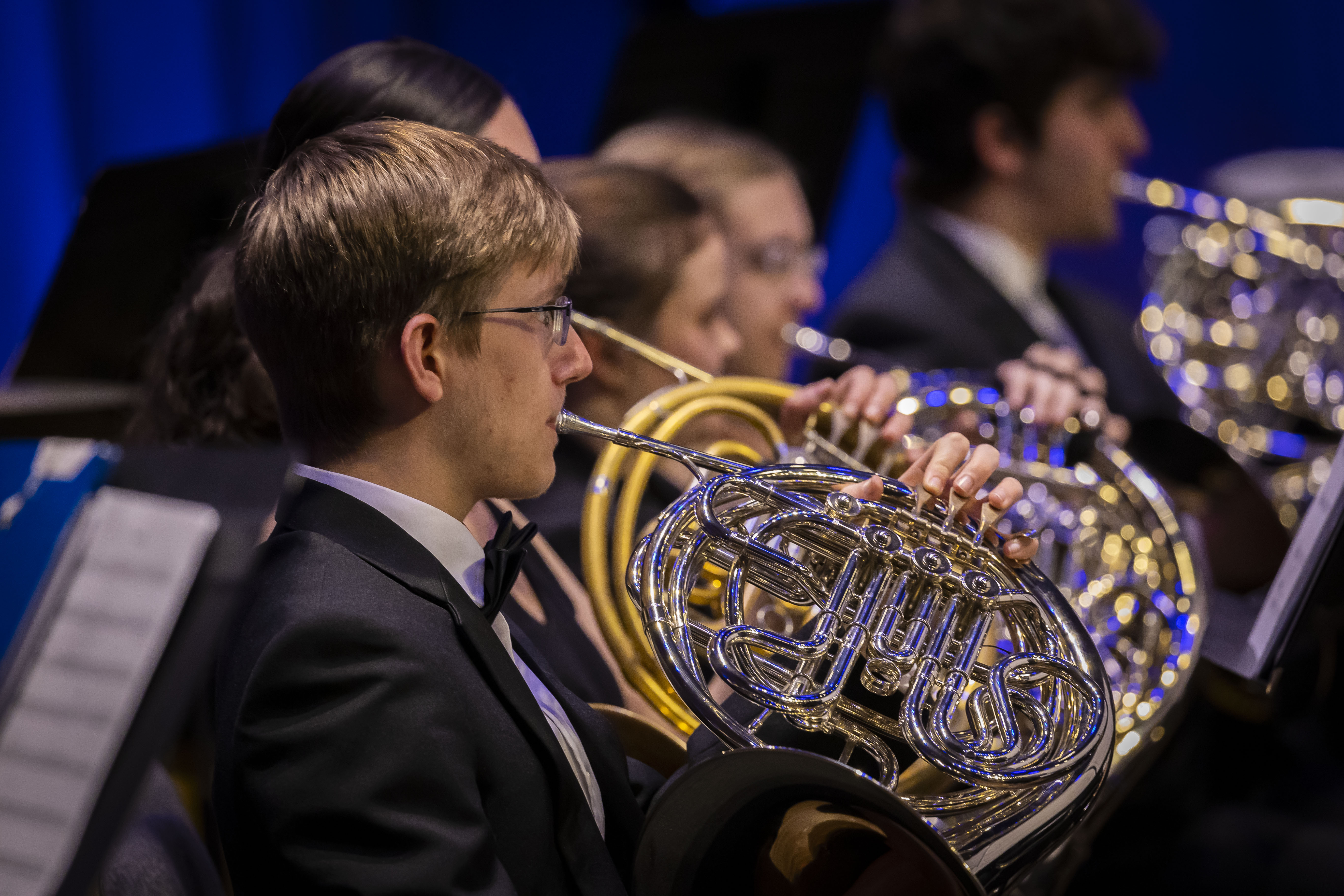 person playing french horn