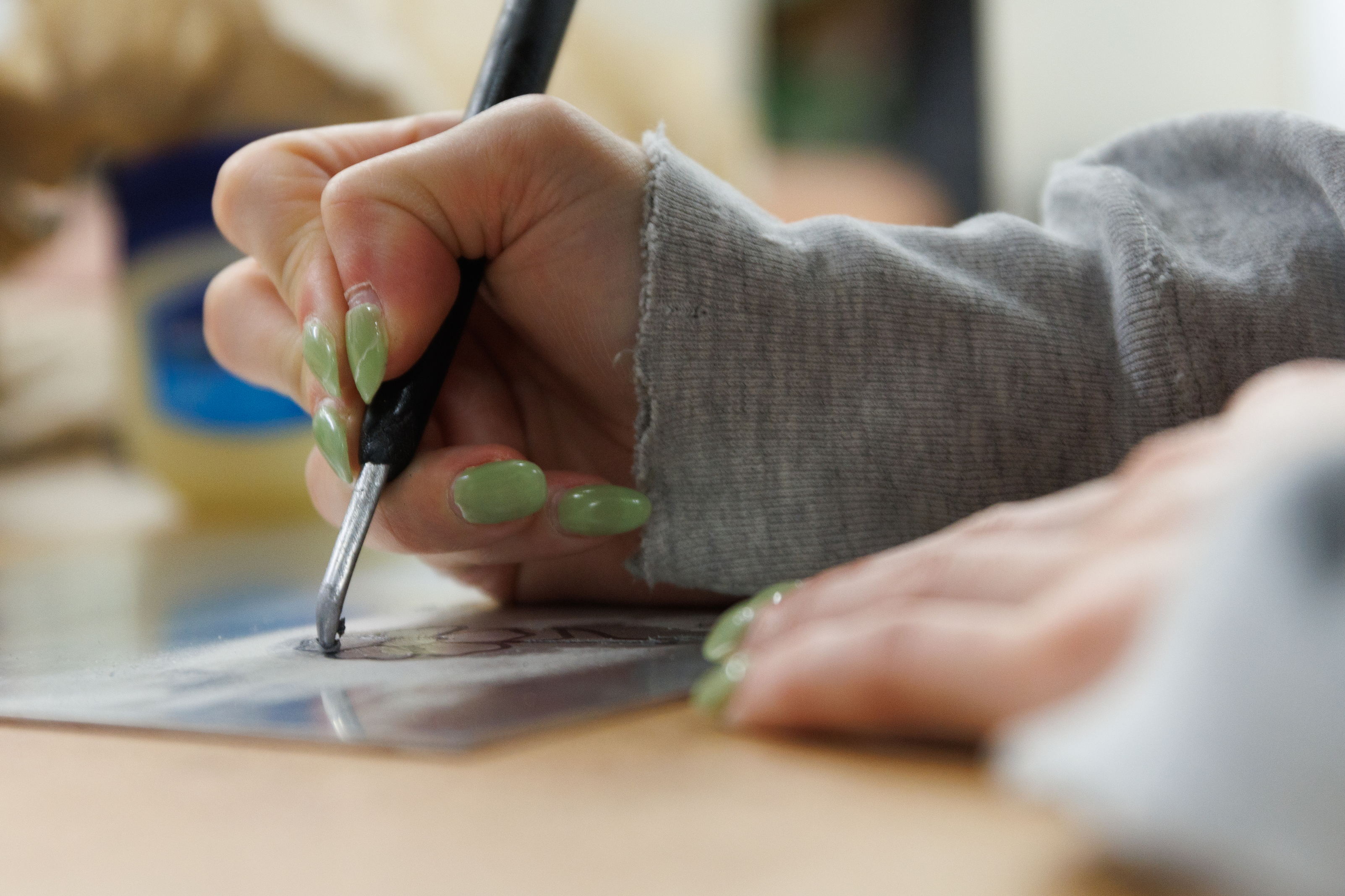 close-up of student in printmaking class