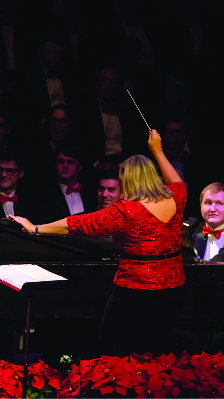 Lori Hetzel conducting choir