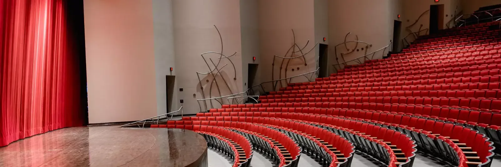 singletary center house seats and partial stage view with red curtain
