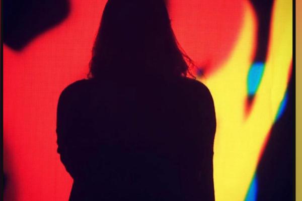 silhouette of person on red abstract background