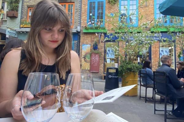 image of Meg Klosterman at a cafe in Paris
