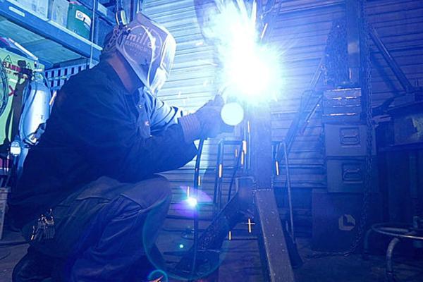 Jeremy Colbert working on metal art