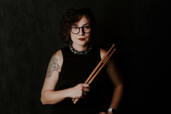 Image of Emily Durocher holding drum mallets 