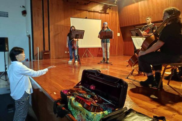 Tze-Ying Wu directs the Ionian University String Ensemble in Corfu, Greece.