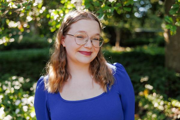Elizabeth Watson in front of trees