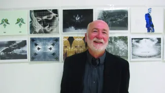 Michael Braun on wall with art