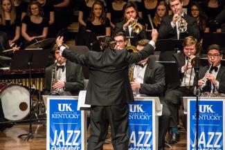 jazz students performing on stage with conductor in front