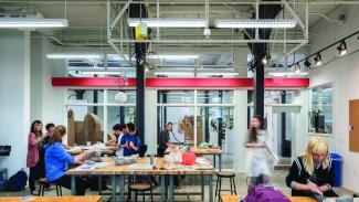 students working at brightly lit tables