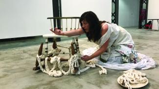 person on floor in performance art piece