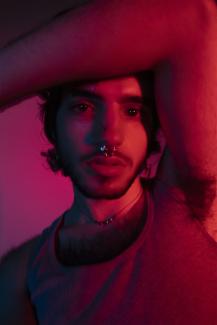 person looking at the camera on red background