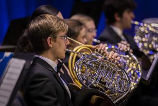 person playing french horn