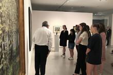 dancers looking at art in berlin gallery