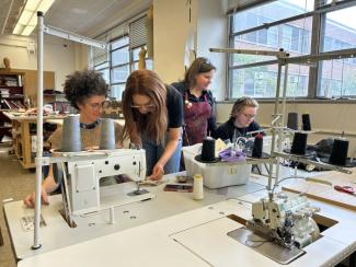 students at sewing machine
