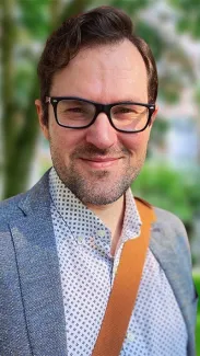 Headshot of Jason Rosenholtz-Witt