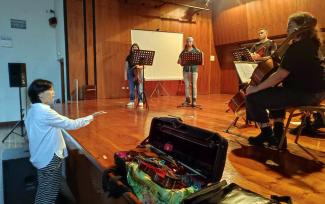 Faculty on stage rehearsing in Corfu