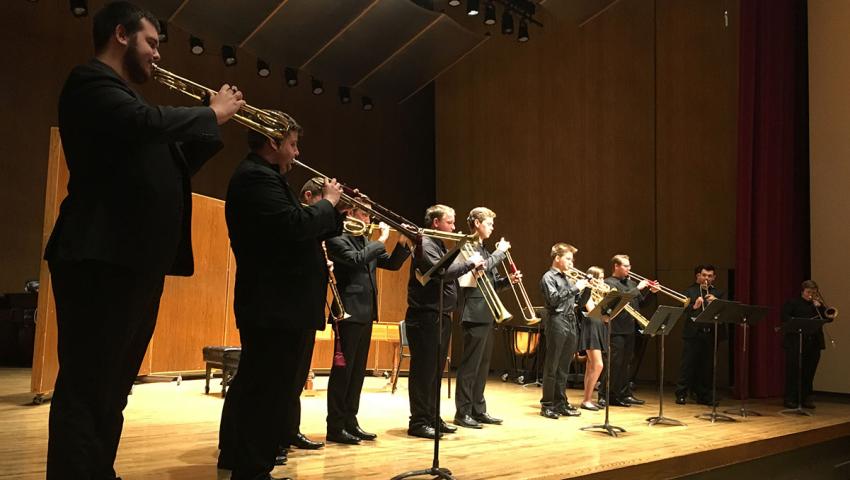 people playing trumpet on stage