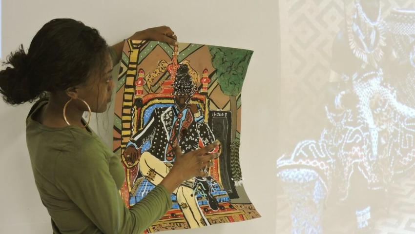 Student looking at art