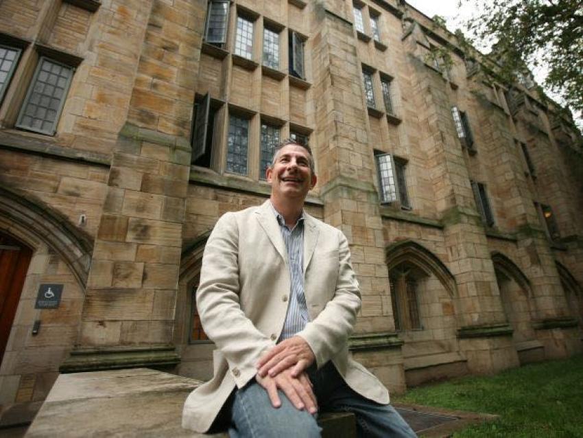 Scott Frieman sitting outside Yale