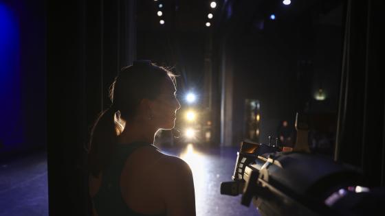 back of person backstage looking sideways