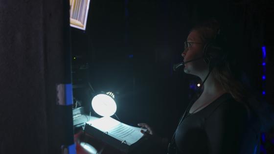 Student backstage at production of Urinetown