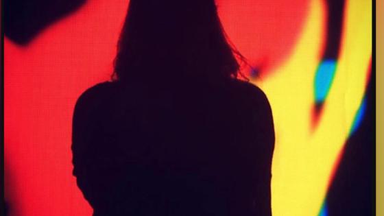 silhouette of person on red abstract background