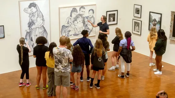 students looking at art in museum