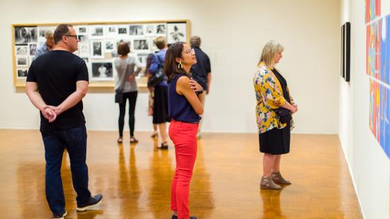 people looking at art in gallery