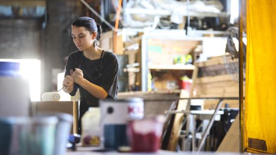 student working in theatre scene shop