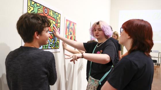 students looking at art in gallery
