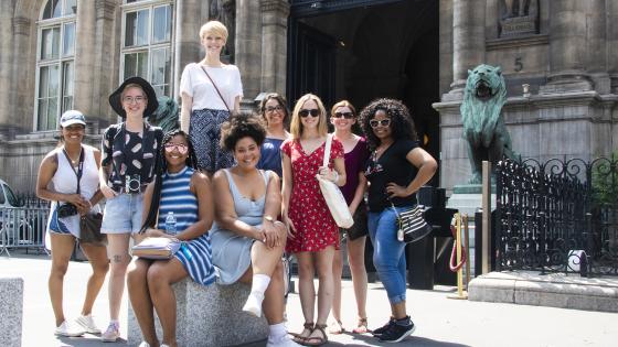 students posed in front of building in paris