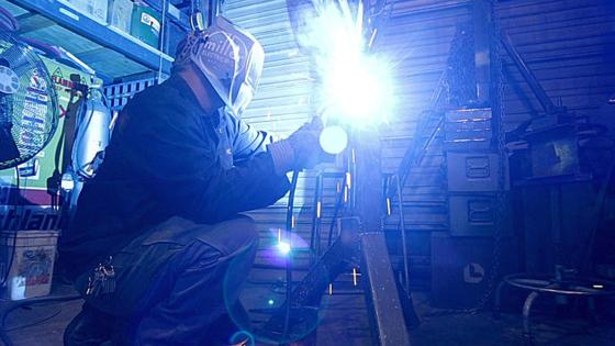 Jeremy Colbert working on metal art