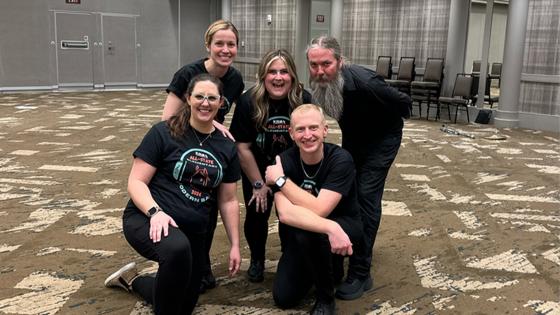 Clockwise, from back left: Martina Vasil, Taylor Ayotte, Austin Robinson, David Dockan and Kailey Holmes. This group of educators helped coordinate the first all-state elementary modern band performance at the '24 KMEA conference. Photo provided.