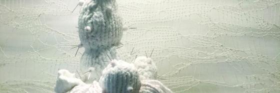 Fiber basket and white sculptures