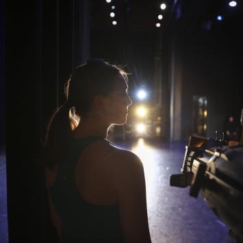 back of person backstage looking sideways