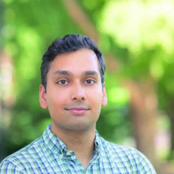 Shaan Azeem with tree in background