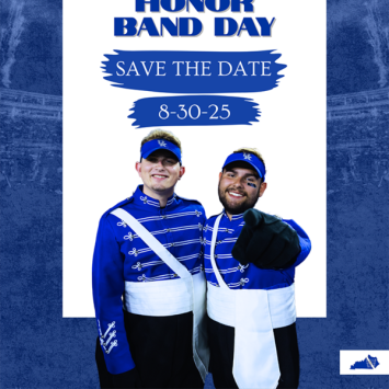 two band members in blue looking at camera
