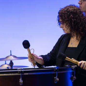 student playing drum on stage