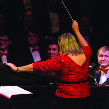Lori Hetzel conducting choir