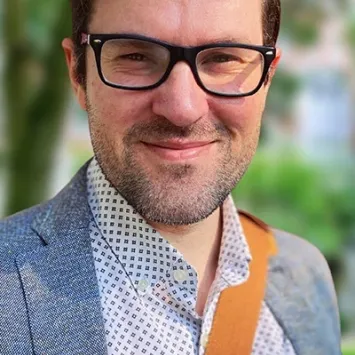 Headshot of Jason Rosenholtz-Witt