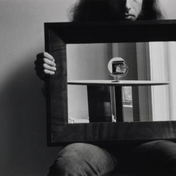 person holding mirror